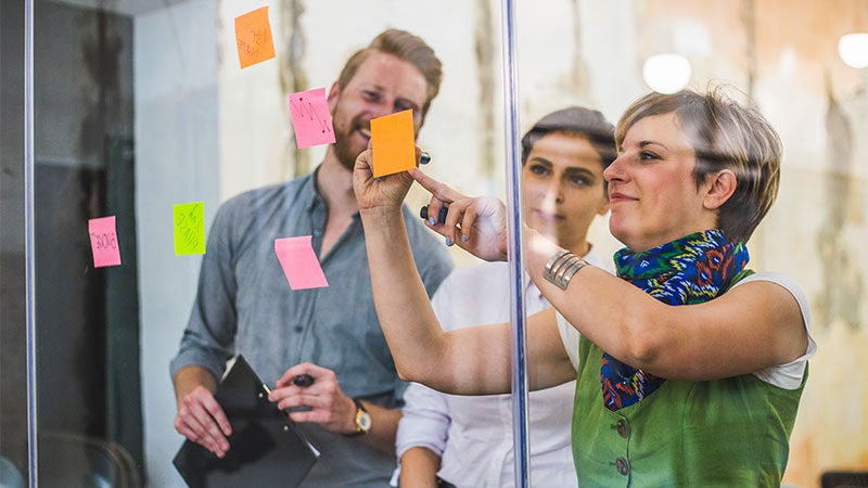 People collaborating with post-its