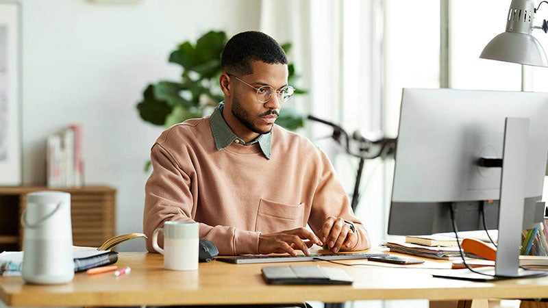 Person at computer attending a webinar