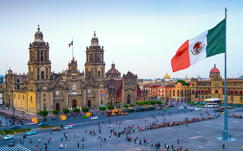 The Mexican flag waving at Zócalo in Mexico City