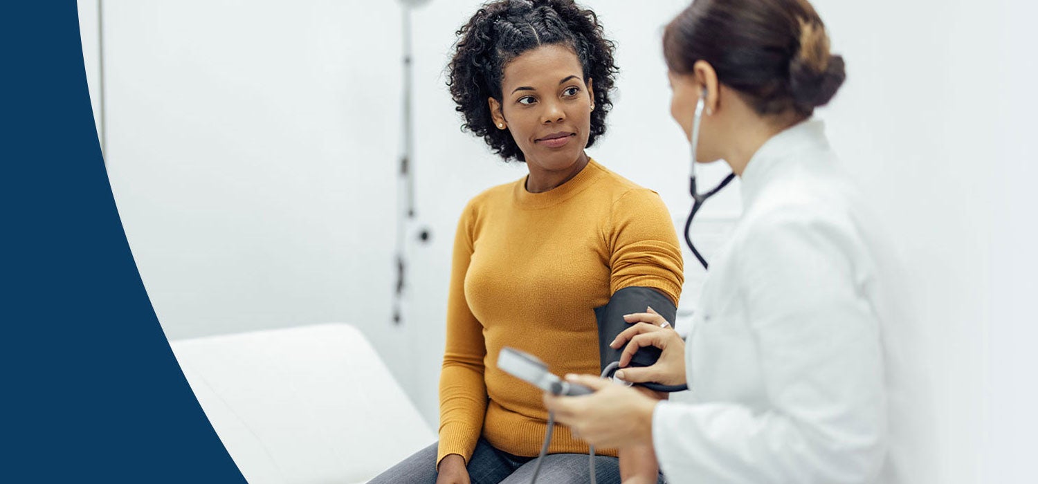 Doctor testing a patient's blood pressure