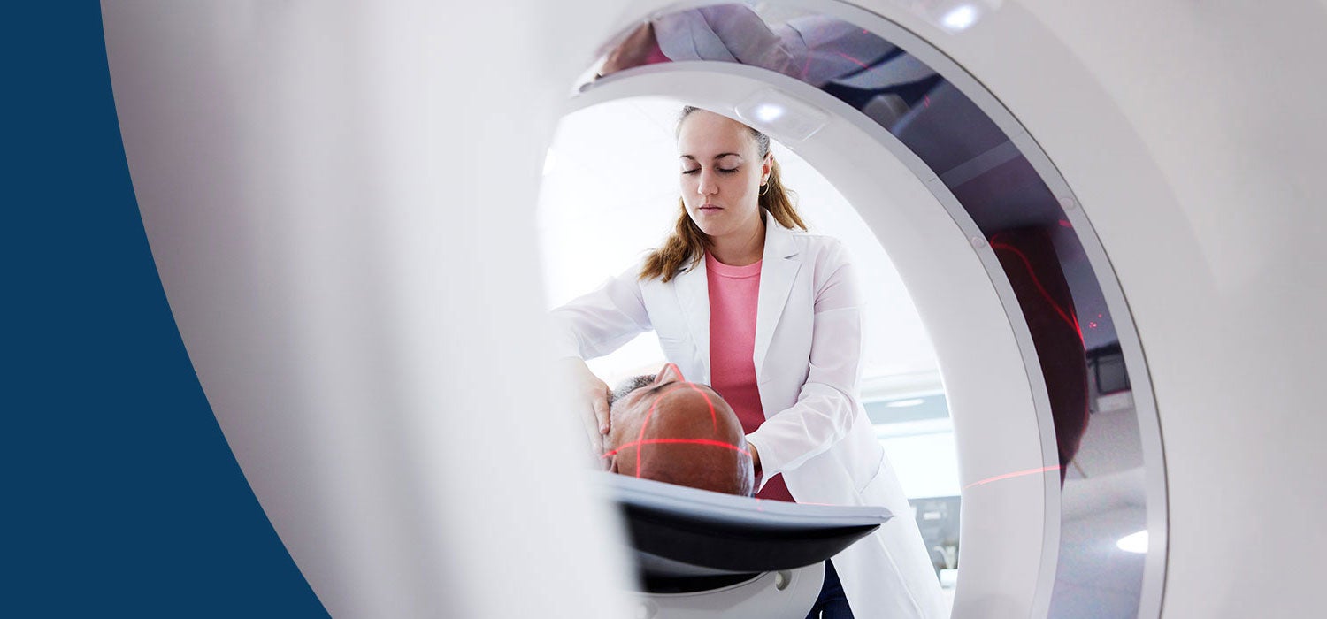 Doctor giving a patient an MRI scan