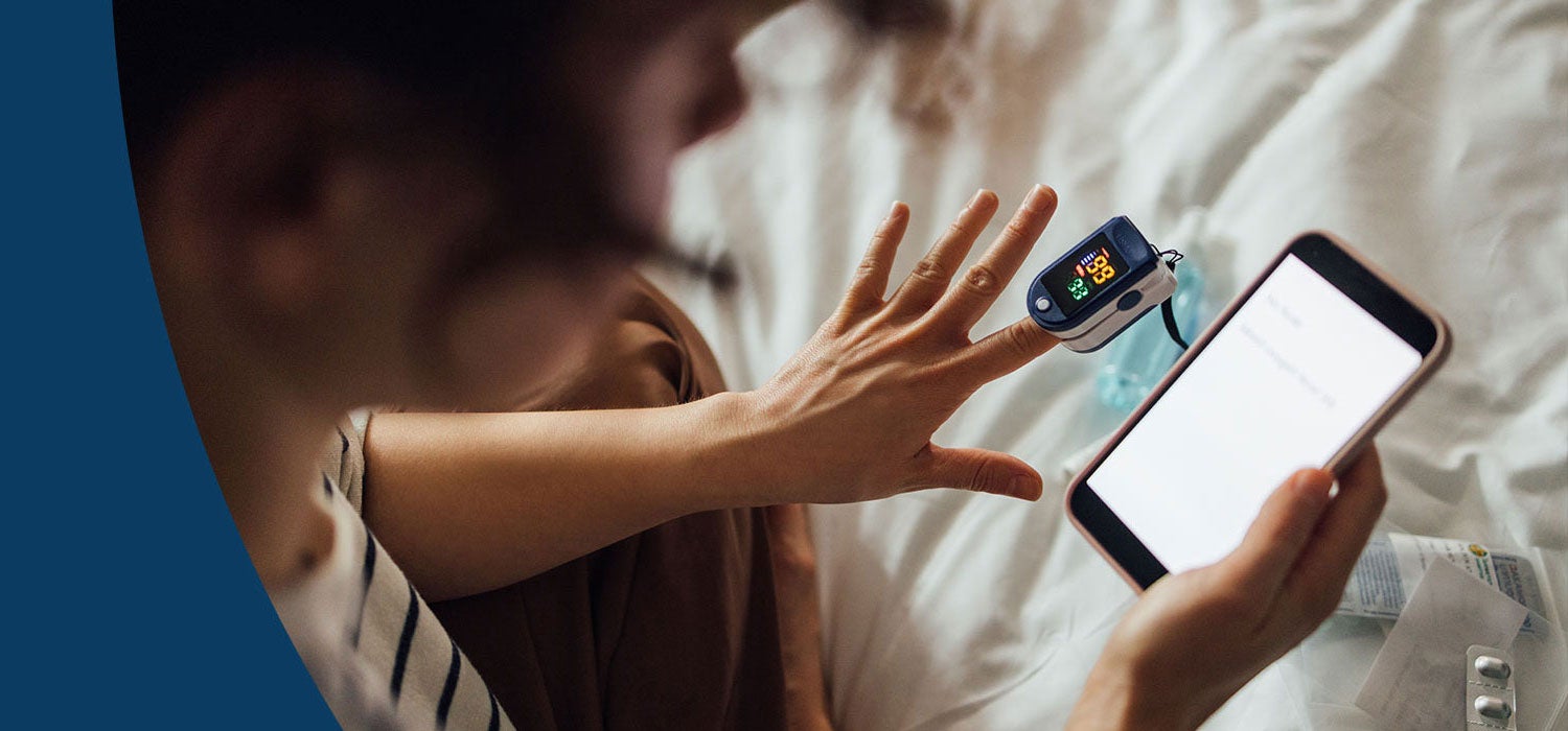 Person using a smart phone to test oxygen level