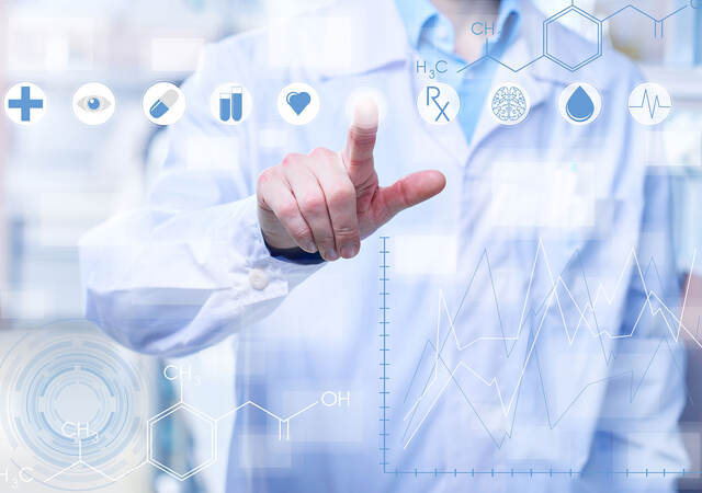 Person touching a graphic interpretation of a medical touch screen