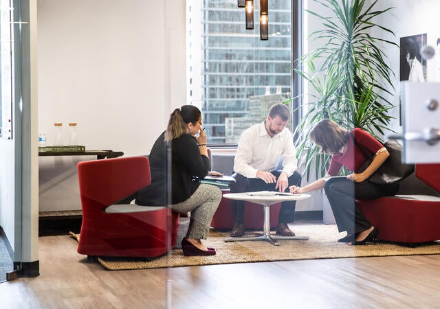 Group of people presenting in a conference room