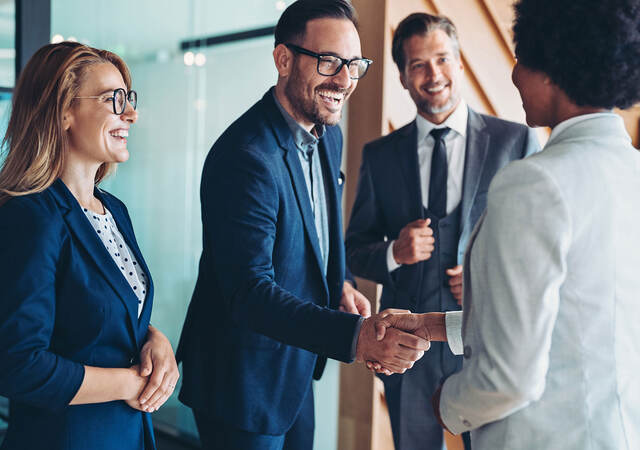 Business colleagues shaking hands
