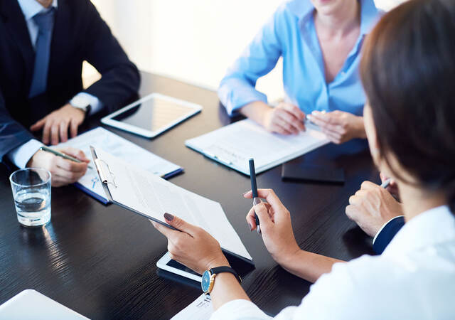 People having a meeting in a conference room