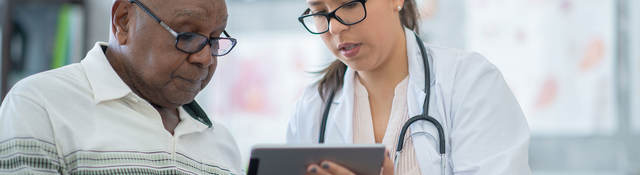 A doctor reviewing results with a patient