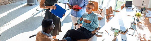 Two people in an office having a discussion