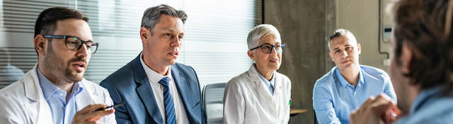 Meeting between doctors and business colleagues