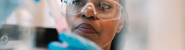 Lab technician filling a syringe