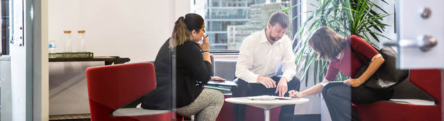 Group of people presenting in a conference room