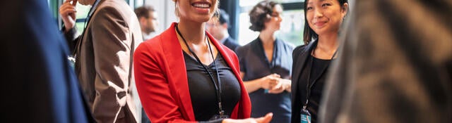 People shaking hands at a business event
