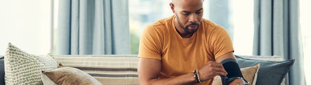 Man trying an at-home blood pressure device