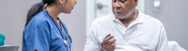 Nurse examining older patient