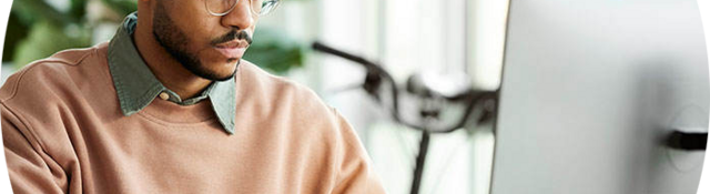 Person sitting at a desk taking an online webinar