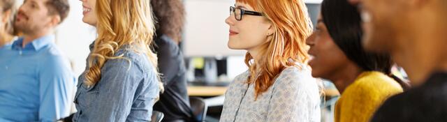 Group of people attending a presentation