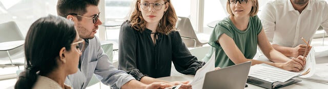 Group of colleagues having a meeting in a contemporary office setting