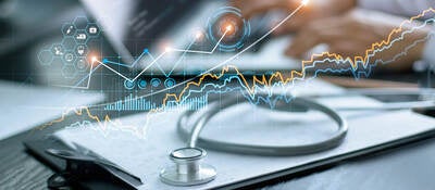 Charts and graphs superimposed over an a medical desk