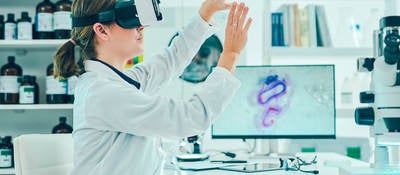 A doctor in a lab testing a medical device