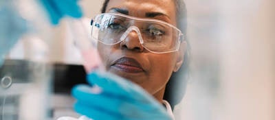 Lab technician filling a syringe