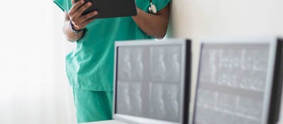 Nurse looking at x-rays