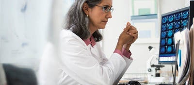 Doctor reviewing x-rays on a computer