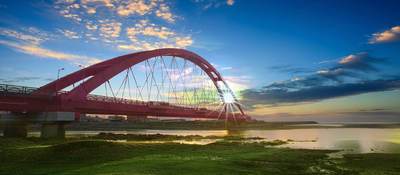 Scenic photo of suspension bridge at sunrise