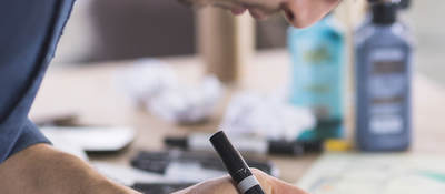 Person taking notes at a desk