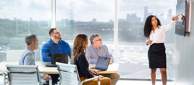 Person presenting in a conference room