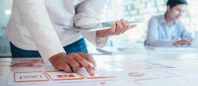 User interface designer mapping out design flow chart.