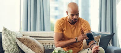 Man trying an at-home blood pressure device