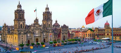 The Mexican flag waving at Zócalo in Mexico City