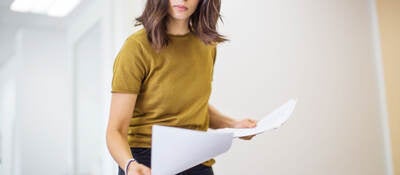 Person reviewing paperwork