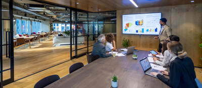Group of colleagues having a meeting in a contemporary office setting