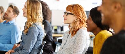 Group of people attending a presentation