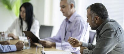 Business team having corporate meeting in the office.