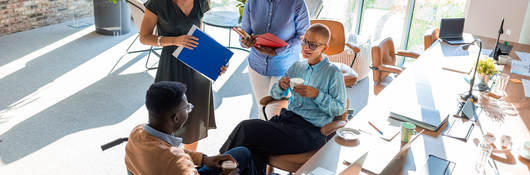 Two people in an office having a discussion