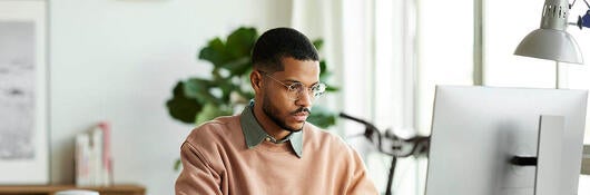 Person at computer attending a webinar