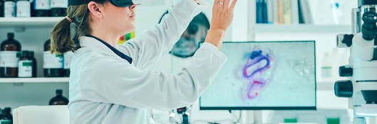 A doctor in a lab testing a medical device