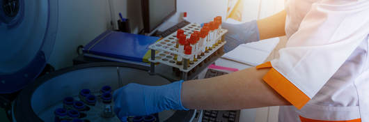 Lab technician running tests on samples