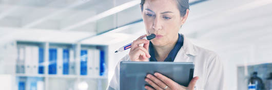 Scientist reviewing data on a tablet