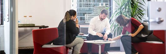 Group of people presenting in a conference room