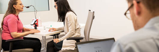 Two doctors are evaluating a patient in a lab