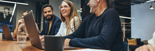 Group of colleagues having a meeting in a contemporary office setting