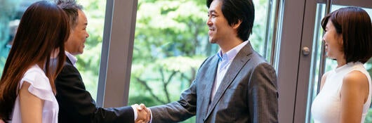 Two business colleagues shaking hands