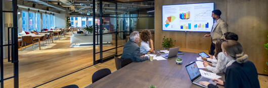 Group of colleagues having a meeting in a contemporary office setting
