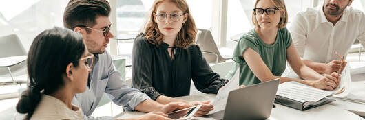 Group of colleagues having a meeting in a contemporary office setting