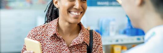 woman buying pharmacy product