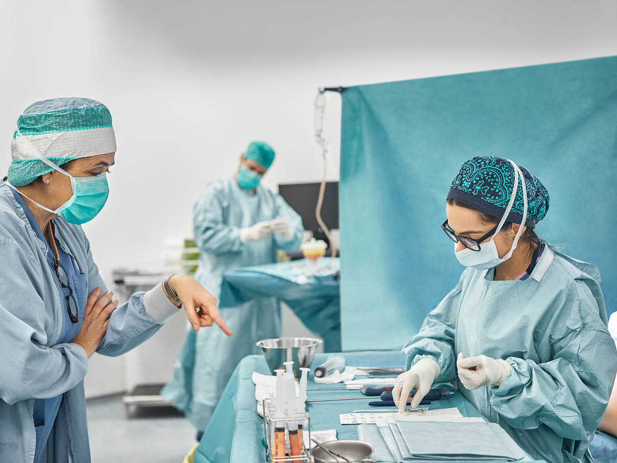 Surgeons operating on a patient