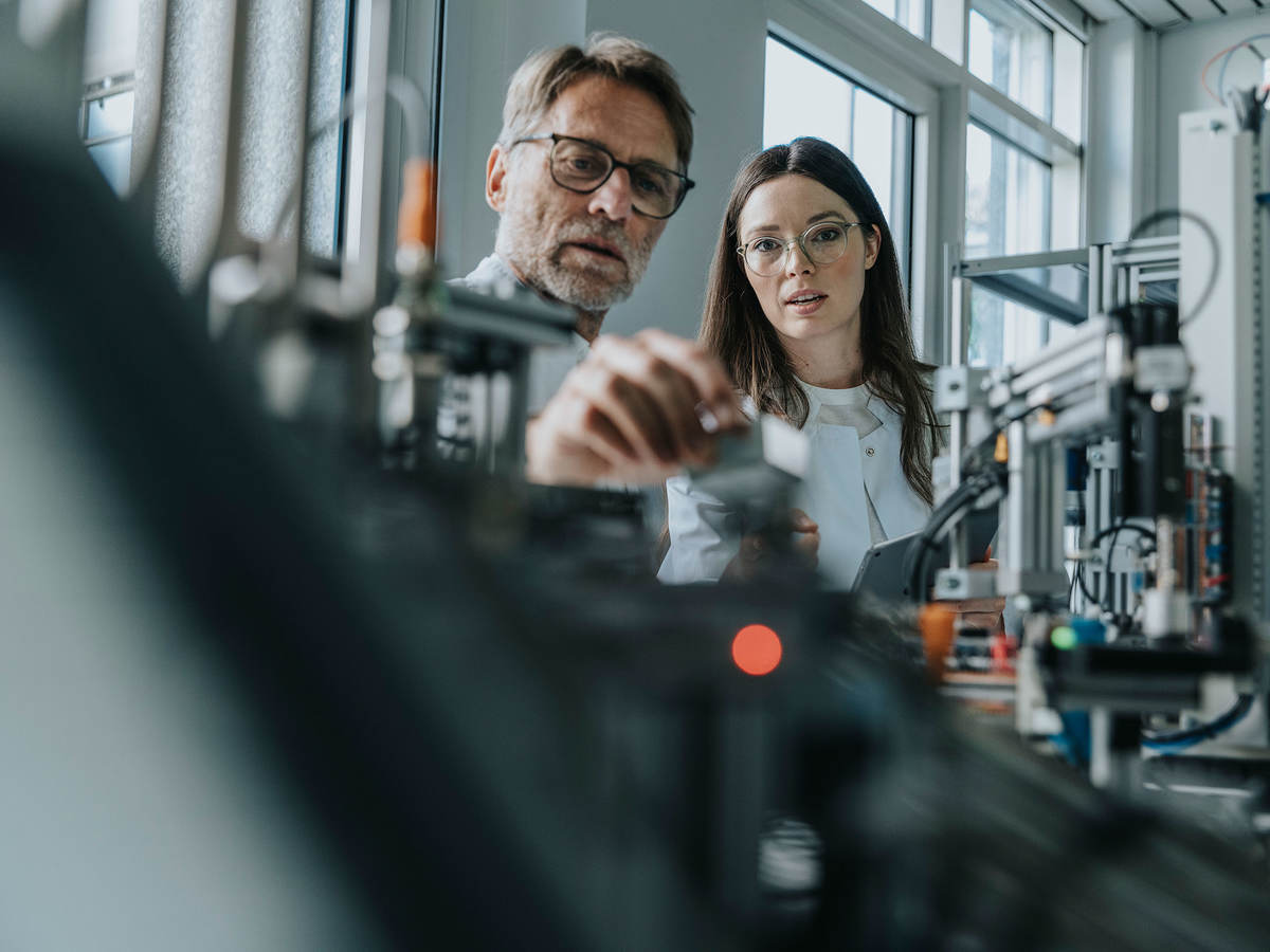 People in a lab testing components